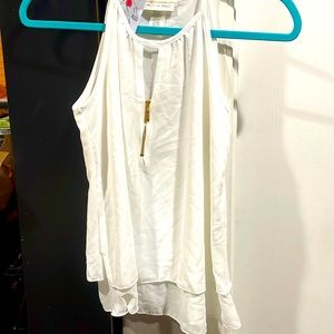 Size small shirt fits a medium. Brand new from boutique that closed down.